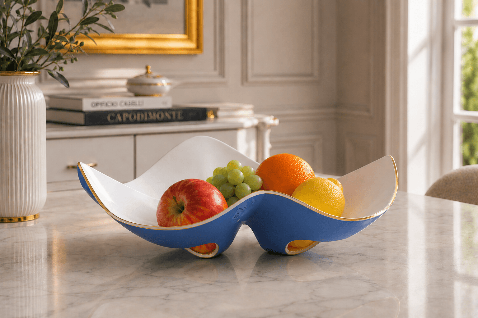 The Casatiello fruit bowl in a classic interior, blue and gold finish